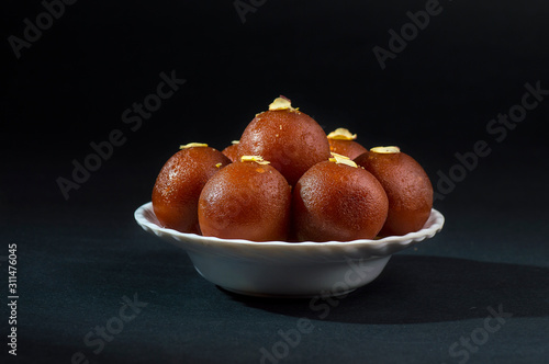 Gulab Jamun, Indian dessert topped with pistachio