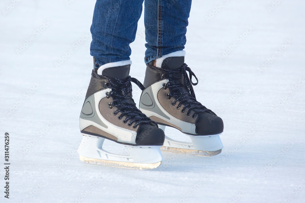 feet skating on the ice rink. Hobbies and sports. Vacations and winter activities. feet skating on the ice rink. Hobbies and sports. Vacations and winter activities.