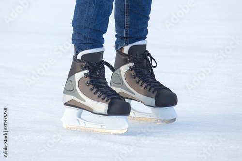 feet skating on the ice rink. Hobbies and sports. Vacations and winter activities.