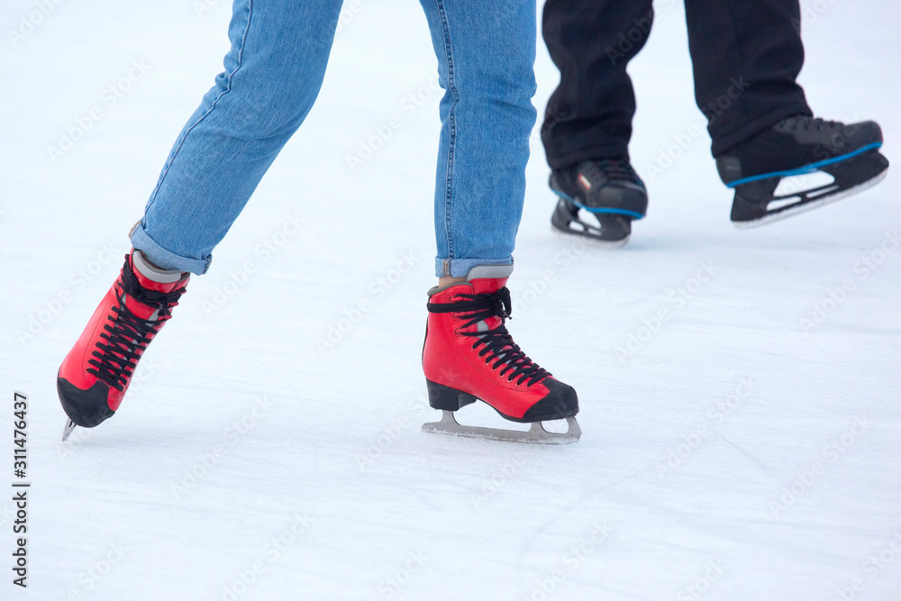 different people are actively skating on an ice rink. Hobbies and sports. Vacations and winter activities. different people are actively skating on an ice rink. Hobbies and sports. Vacations and winter activities.
