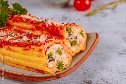 Εκτύπωση καμβά Italian food cannelloni with ricotta and tomato sauce. Close up.