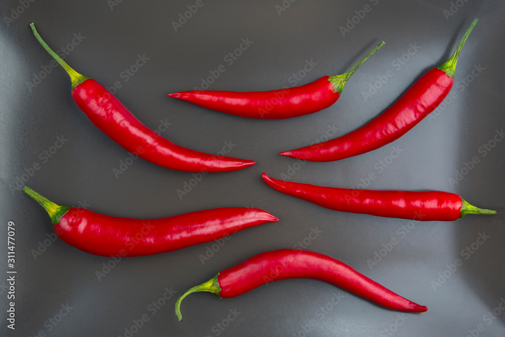 Red hot pepper close up on a grey plate Healthy vegetable food and vitamins