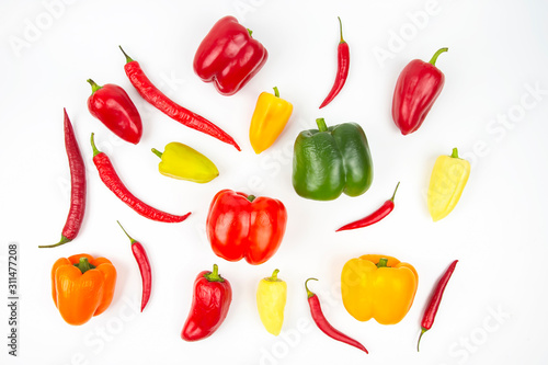 different colored sweet and bitter peppers on a white background. vitamin food