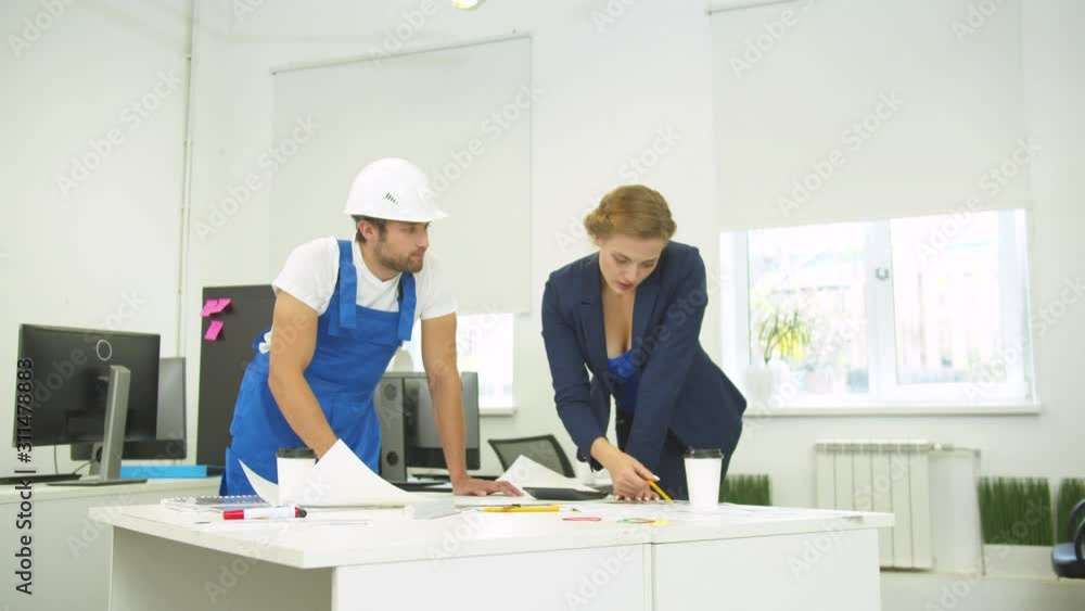 Engineer and builder draw on whatman paper with pencil and ruler and calculate Engineer and builder draw on whatman paper with pencil and ruler and calculate