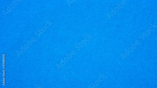 Close up of blue woolen fabric for a background.