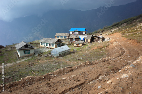 Old guest house is semi abandoned after earthquake in Nepal Himalayas, Before Lamjura La pass on trail between Jiri and Lukla - lower part of Everest trek