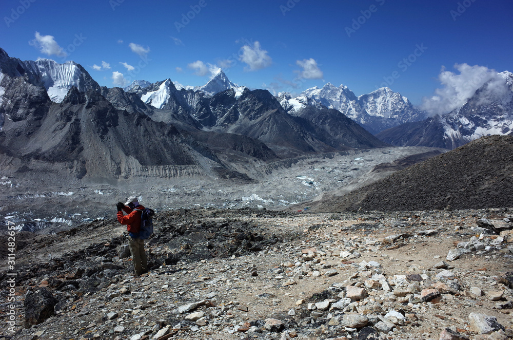 Everest trek, Tourist is photographing from Kala Patthar of Khumbu Glacier and mountains. Sagarmatha national park, Solukhumbu, Himalayas, Nepal