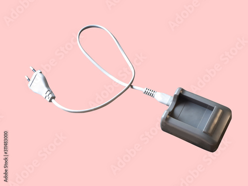 Battery charger brown box. On a pink background,with clipping path