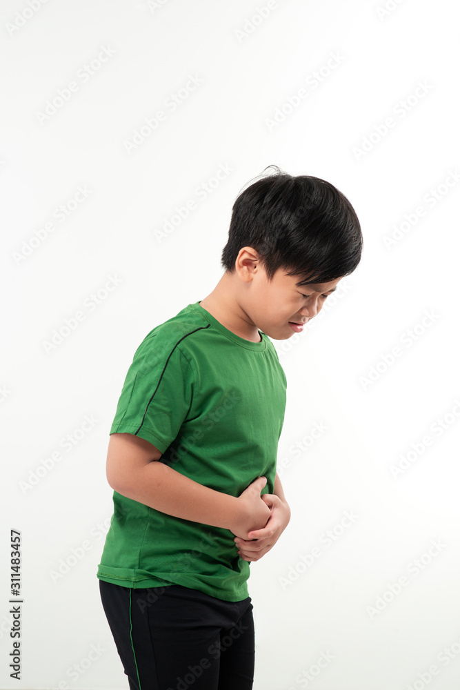 Adorable little boy suffering from abdominal pain, copy space. Young boy having stomachache Adorable little boy suffering from abdominal pain, copy space. Young boy having stomachache
