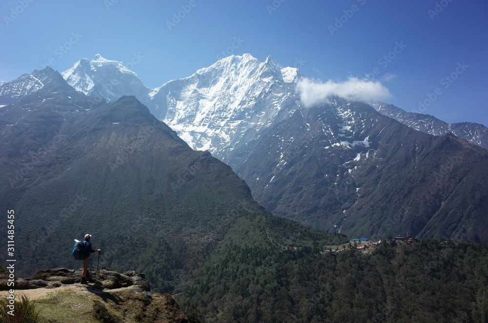 Everest trek, Tourist is standing on Pangboche - Portse upper trail with view of Tengboche village. Mountains Himalayas, Sagarmatha national park, Solukhumbu, Nepal