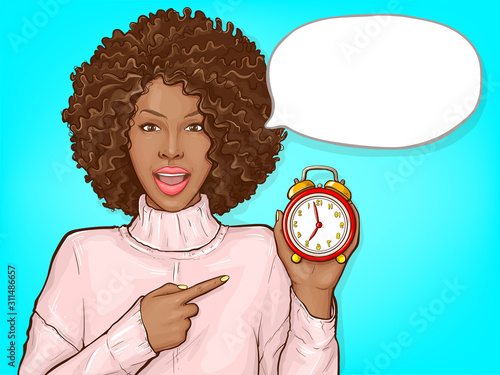 African american woman pointing by finger to red alarm clock. Black girl with afro hair and open mouth show time. Vector pop art illustration of dark skin lady with speech bubble