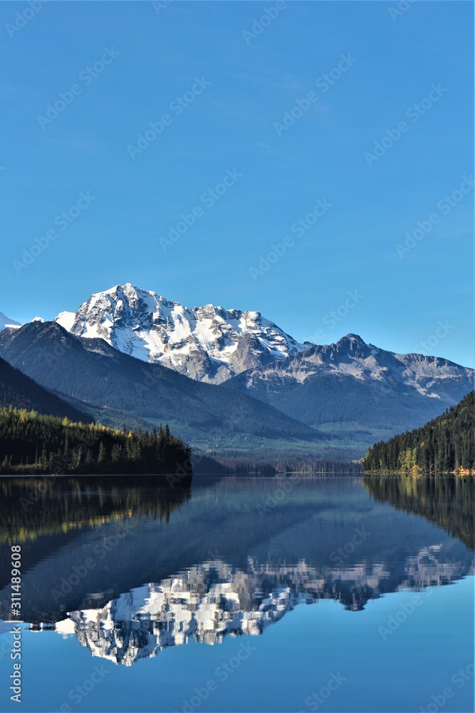 What a beautiful view to a reflection lake in Western Canada, near whistler. Typical canadian panoramic view with mountain in the background. So lovely. Near Whistler