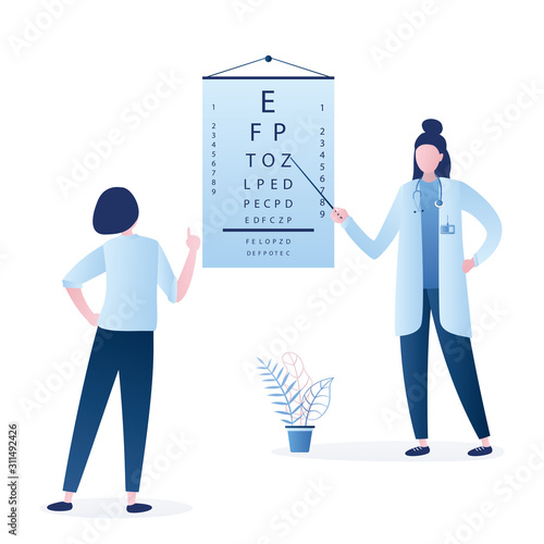 Doctor optometrist checks vision in a male patient. Eye test chart. Vision test. Optical exam. Healthy sigh
