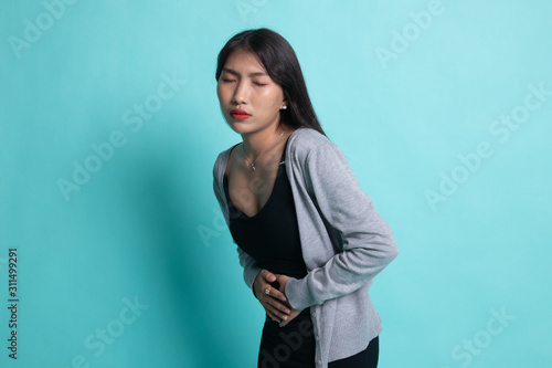 Young Asian woman got stomachache. © halfbottle