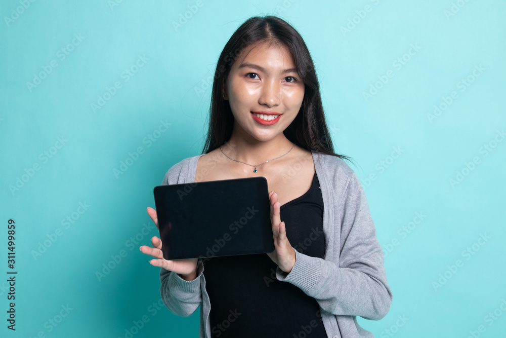 Young Asian woman with a computer tablet. Young Asian woman with a computer tablet.