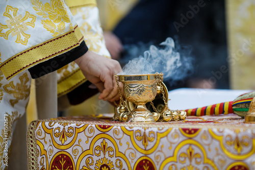 Fotografie, Obraz Details with a golden metallic christian orthodox frankincense burner, or censer
