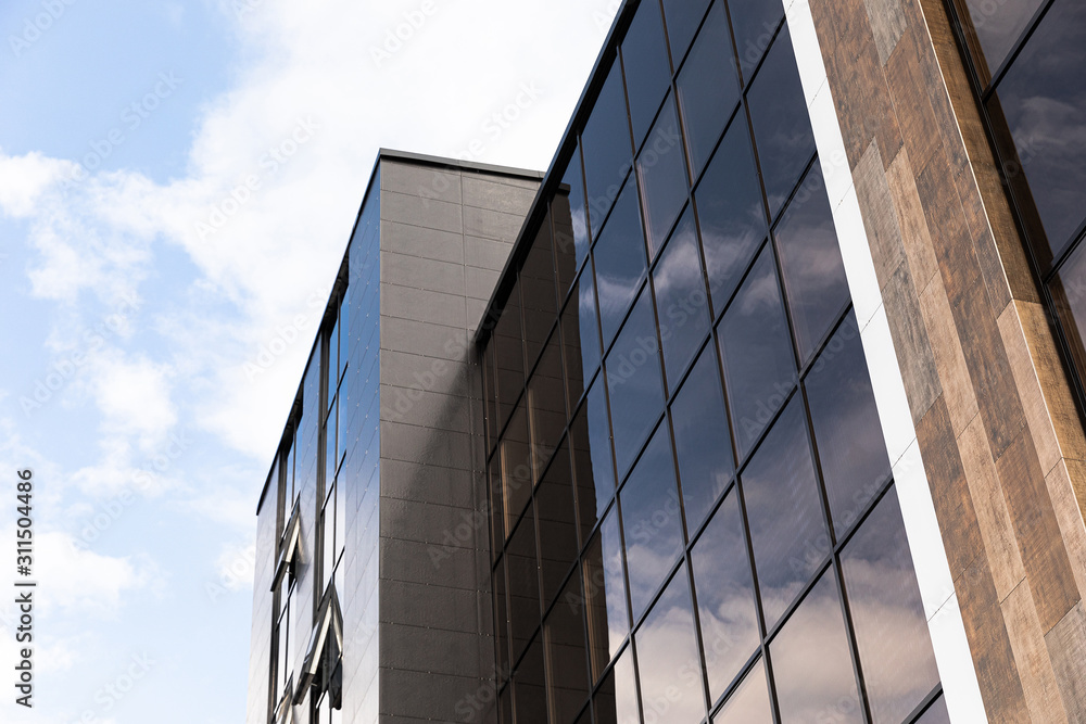Tall modern business center building with glass office building Tall modern business center building with glass office building