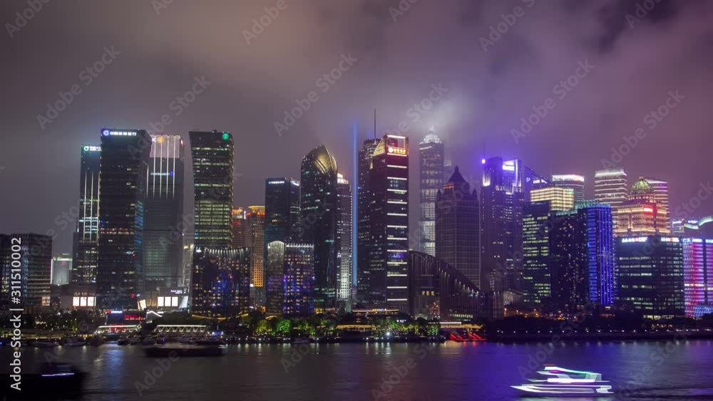 Shanghai Pudong New Area by Huangpu river at night timelapse pan up Shanghai Pudong New Area by Huangpu river at night timelapse pan up