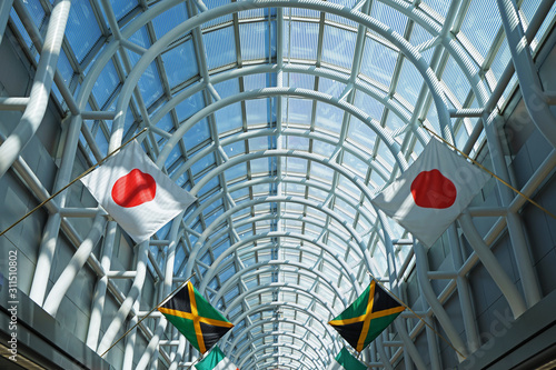 Interior hallway design and terminal decoration at 'CHICAGO O'HARE INTERNATIONAL AIRPORT' decorated with colorful international countries flags- IL, USA photo