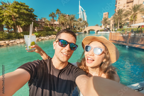 Photography Tourism and holiday resorts - a couple in love during their honeymoon taking a s