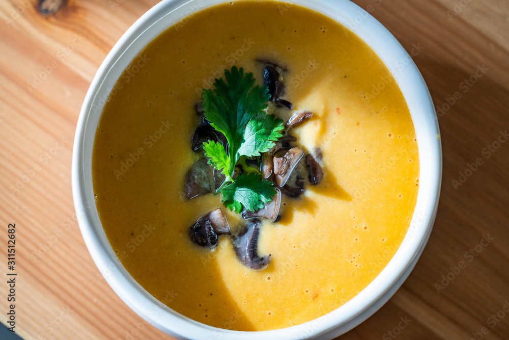 Homemade Thai Sweet Potato Soup with Cilantro, Coconut Milk Cream, Lime and Mushrooms. Homemade Thai Sweet Potato Soup with Cilantro, Coconut Milk Cream, Lime and Mushrooms.