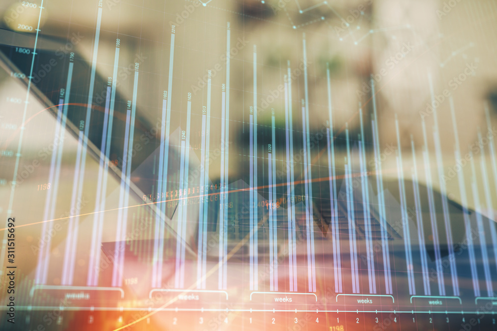 Forex graph hologram on table with computer background. Double exposure. Concept of financial markets. Forex graph hologram on table with computer background. Double exposure. Concept of financial markets.