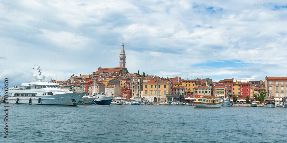 View of the port of Rovinj and old colorfull city on a sunny summer day.