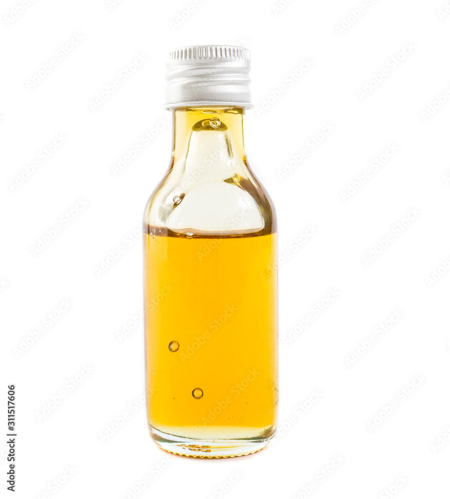 CBD Oil in glass of bottle on white background. CBD Oil in glass of bottle on white background.