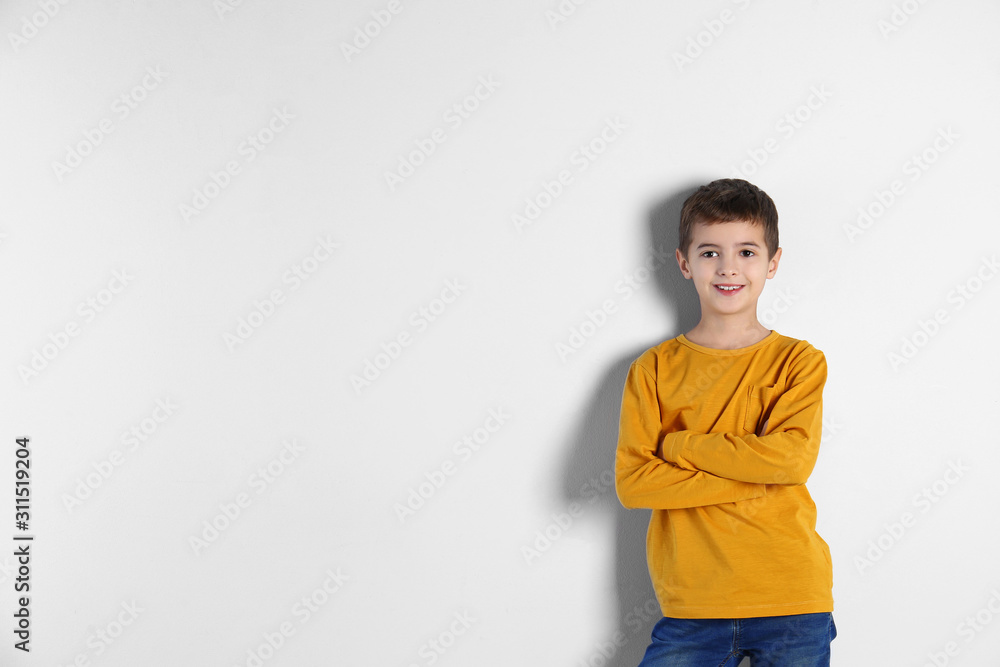 Portrait of cute little boy on light background, space for text Portrait of cute little boy on light background, space for text