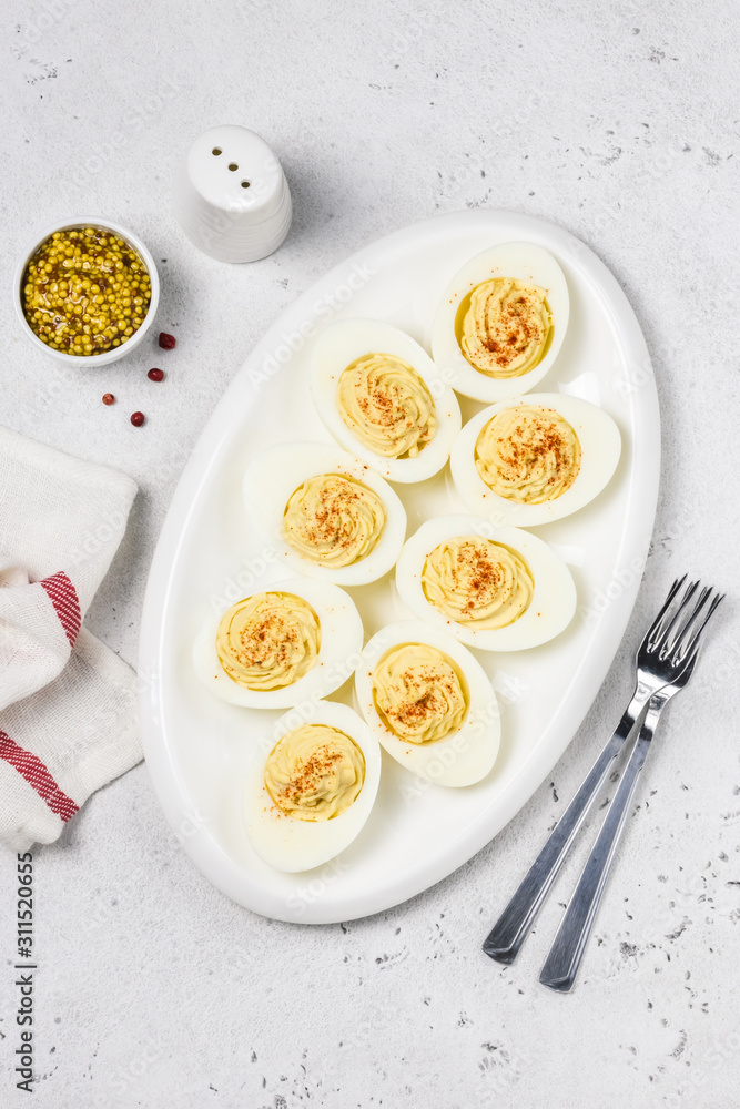 Classic devilled eggs with smoked paprika. Top view, copy space. Classic devilled eggs with smoked paprika. Top view, copy space.