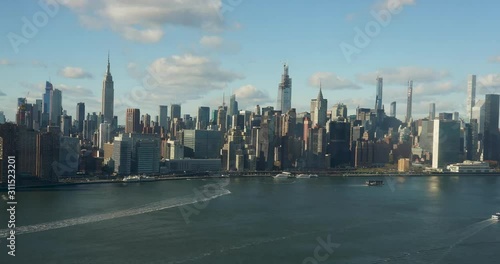 Wallpaper Mural Epic timelapse of NYC East River Skyline. Empire State, chrysler building, United Nations, Sunrise to sunset, with clouds and boats. 4k+ shot on a Canon 1Dx Raw. Torontodigital.ca
