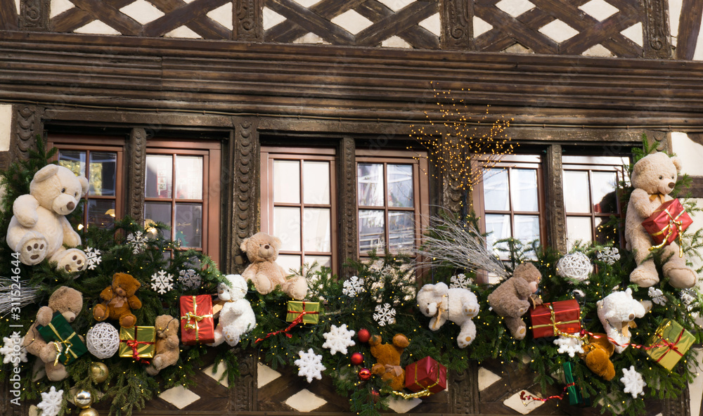 Fototapeta premium traditional Alsace half-timbered house with beautiful Christmas decorations around the windows