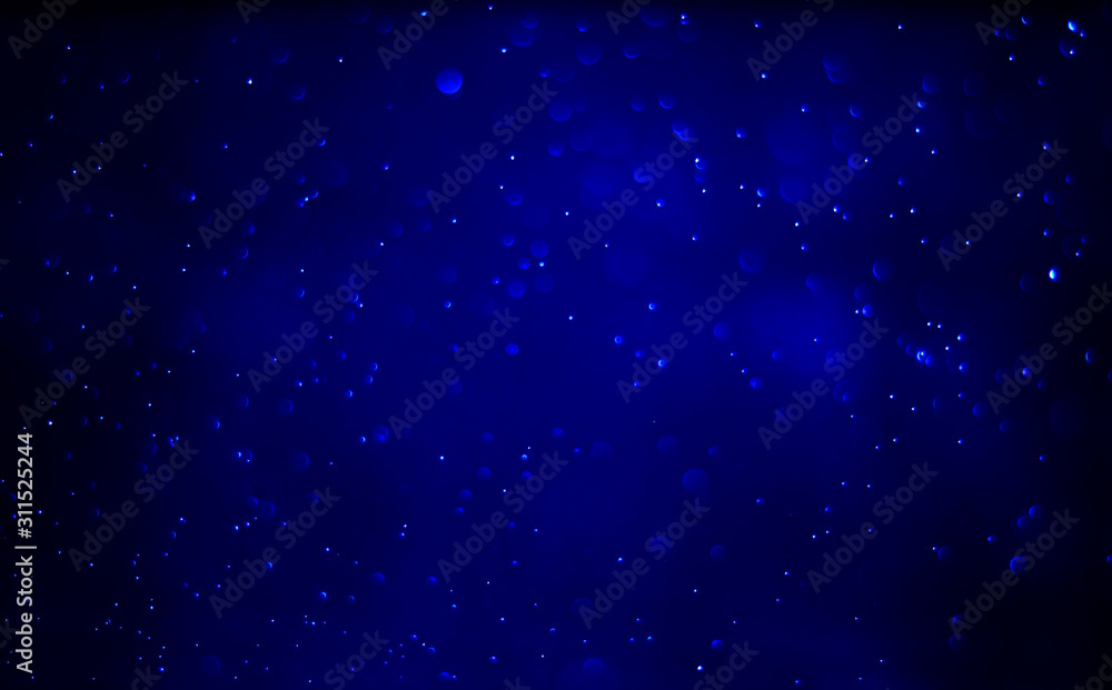 Abstract bokeh light sparkle on dark blue background Abstract bokeh light sparkle on dark blue background