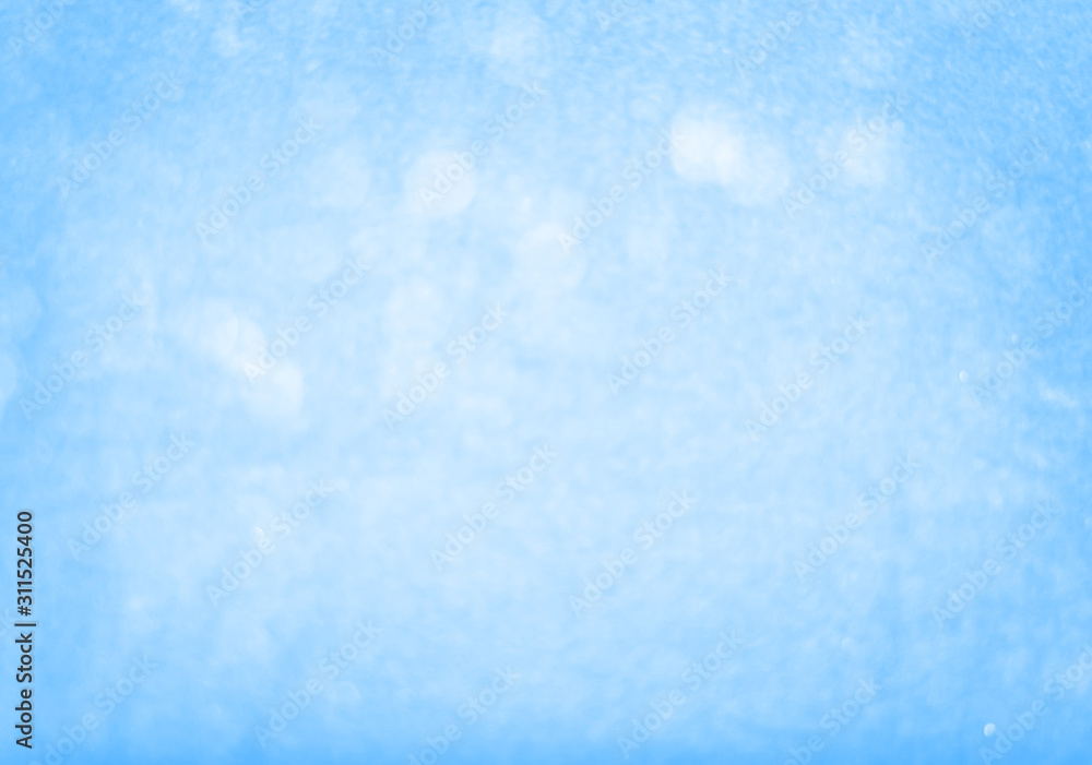 Abstract bokeh light sparkle on blue background