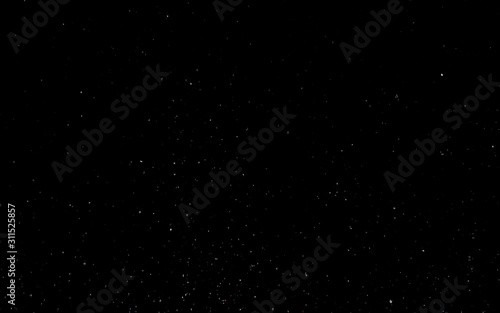 White snow on a black sky. Winter background. Christmas background concept