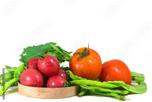 Fresh, healthy vegetables are displayed on white background.