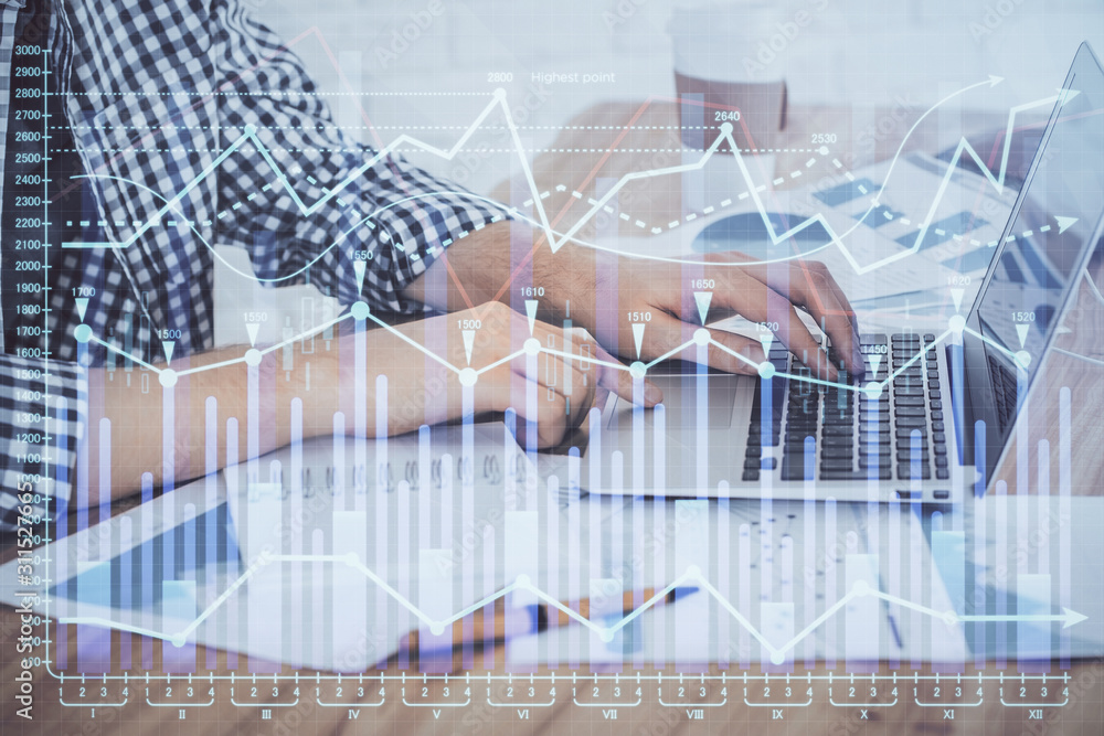 Multi exposure of stock market chart with man working on computer on background. Concept of financial analysis. Multi exposure of stock market chart with man working on computer on background. Concept of financial analysis.
