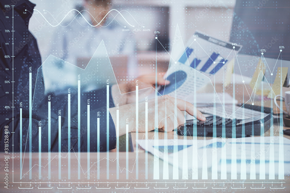 Double exposure of graph with man typing on computer in office on background. Concept of hard work. Closeup. Double exposure of graph with man typing on computer in office on background. Concept of hard work. Closeup.