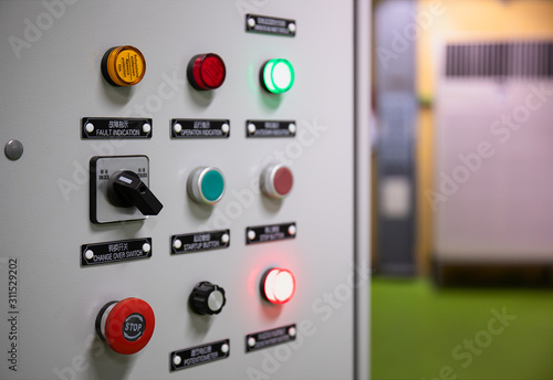 Electrical selector switch,button switch,Electrical switch gear at Low Voltage motor control center cabinet in coal power plant. blurred for background.