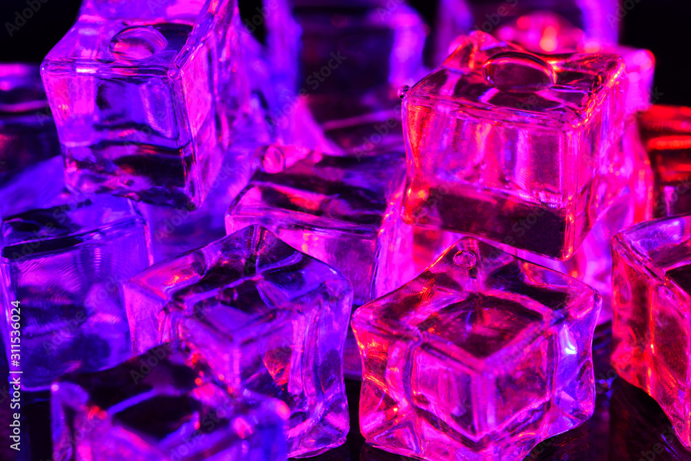 Ice cube. Close-up of ice cubes with pink and purple backlight. Macro horizontal photography Ice cube. Close-up of ice cubes with pink and purple backlight. Macro horizontal photography