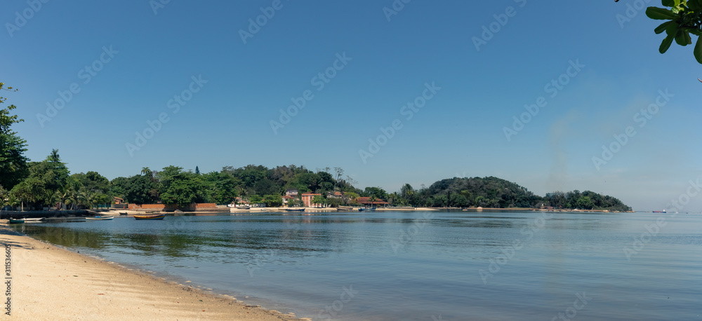 Fototapeta premium Panorama of Sao roque beach with cloudless blue sky, Paqueta, Rio de Janeiro, Brazil