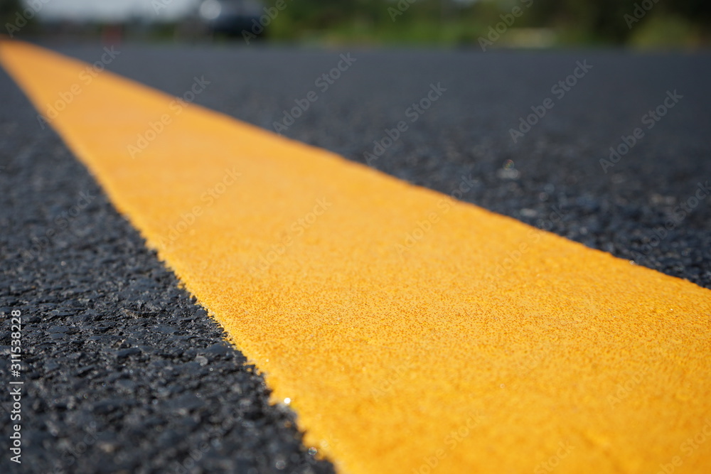 Yellow traffic paint lines during construction phase, blurred pictures