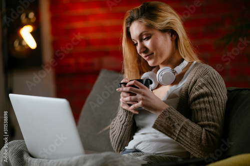 Businesswoman working while sitting on sofa. 