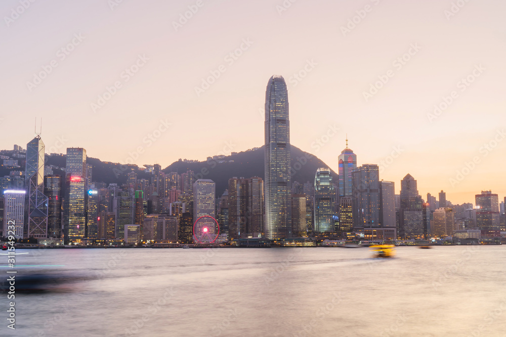 Obraz premium Panorama of Victoria harbor of Hong Kong city, from day to night Cold front in December.