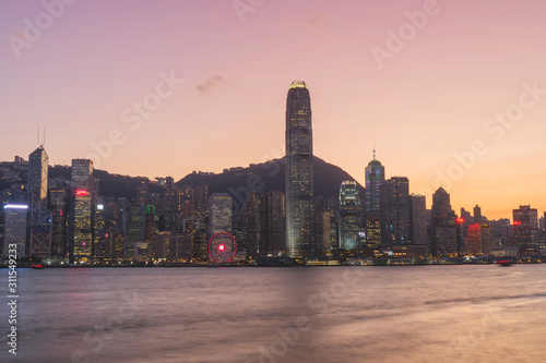 Panorama of Victoria harbor of Hong Kong city, from day to night Cold front in December.