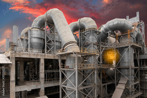 cement plant factory manufacturing have clinker cooler and other plant  at sunset.