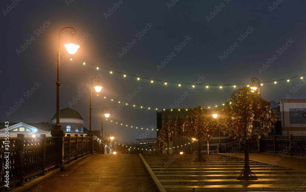 The Tretyakov bridge in Moscow connects Bolotnaya Square with Kadashevskaya Embankment. Evening shooting. Bridge over the drainage channel. View of Lavrushinsky Lane. The Tretyakov bridge in Moscow connects Bolotnaya Square with Kadashevskaya Embankment. Evening shooting. Bridge over the drainage channel. View of Lavrushinsky Lane.