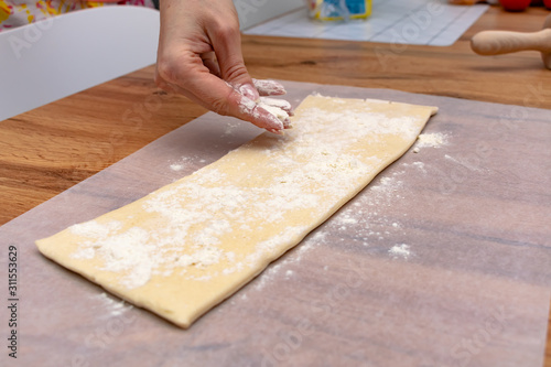 Baker making puff pastry baking
