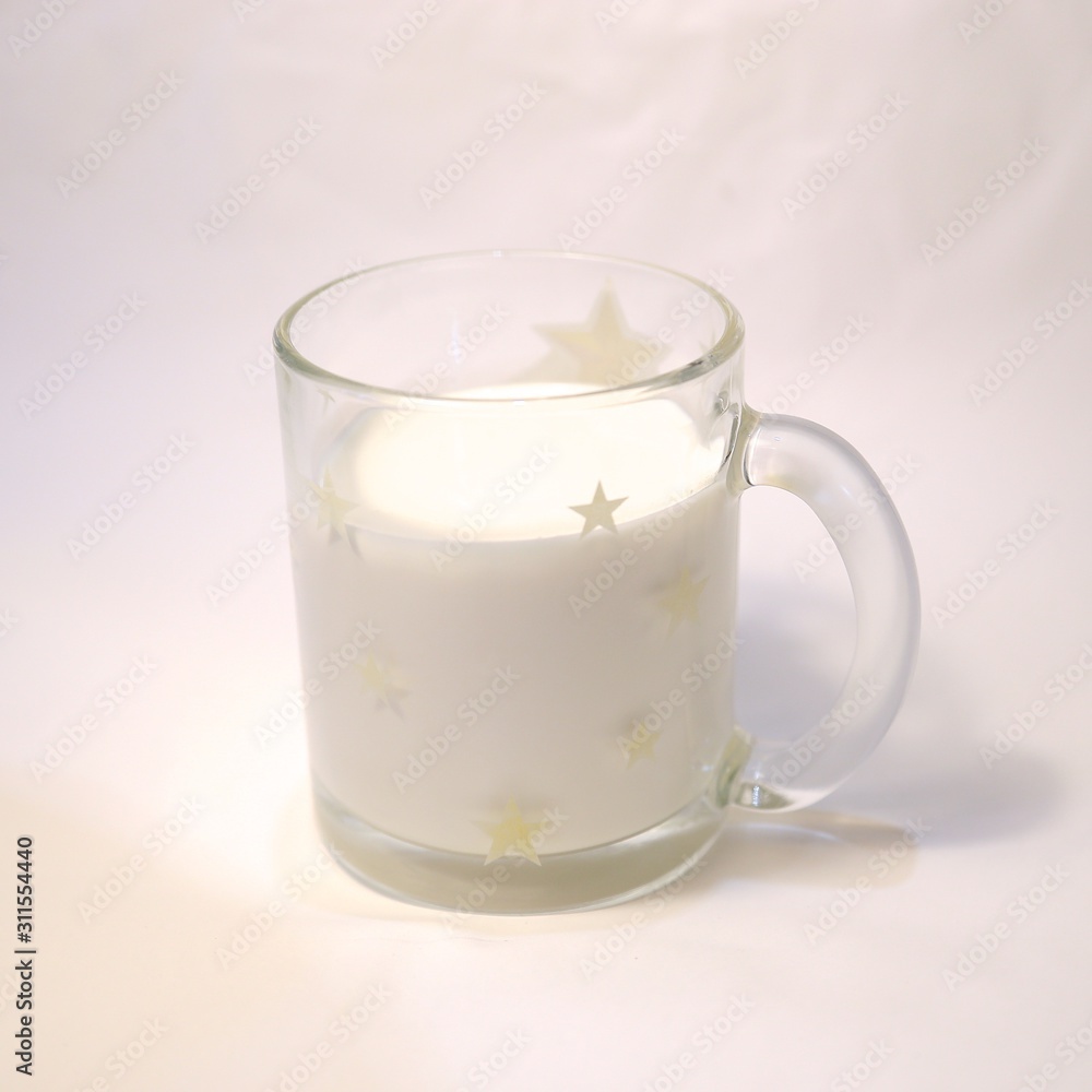Cold milk fresh in a cup of translucent glass Cold milk fresh in a cup of translucent glass