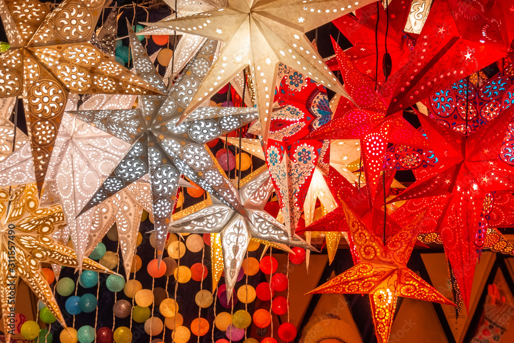 Paper bright multi-colored Christmas and New Year stars decorations.